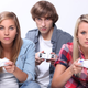 Illustration for article titled Fake Gamers of the Week: Bored Blonde Teenagers with Mismatched Controllers